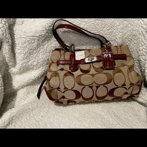 Brand new tan and brown Coach bag.